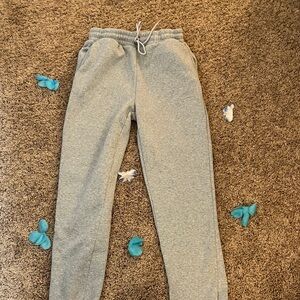 A light gray pair of baggy-ish sweatpants. No cuff with pocket on back